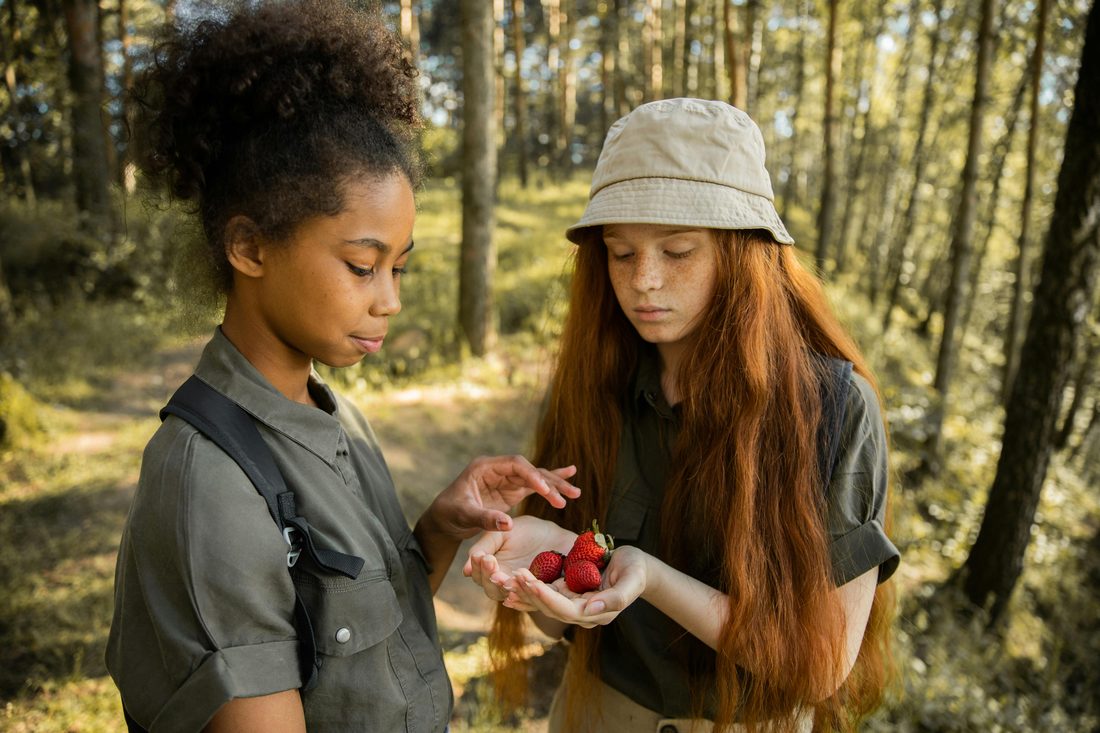 Children foraging together outdoors