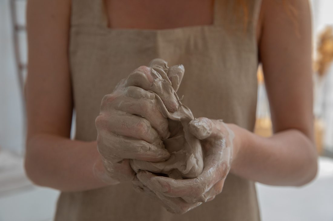 A child working with clay during play therapy